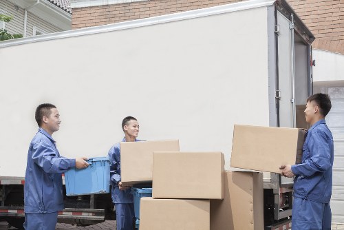 Moving van and packed boxes outside a Southfields home