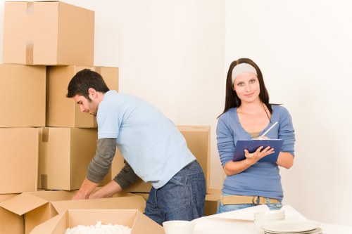 Careful loading of boxes and furniture into a removal van