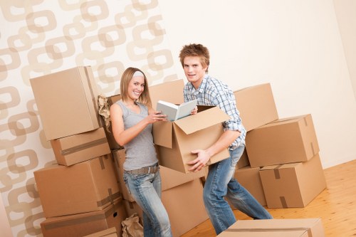 Packed office boxes and labelled equipment ready for a commercial move
