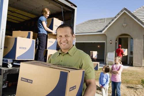 Packed boxes and furniture prepared for a local house removal